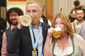Prime Minister Taps Keg At Oktoberfest - Canada