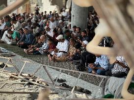 Gazans Pray Amid Destruction - Khan Yunis