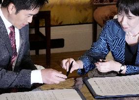 Ruling LDP, JIP sign coalition deal