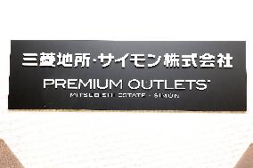 Mitsubishi Estate Simon signboard and logo