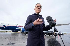 Mark Carney Speaks To Press Before Boarding Plane - Ottawa