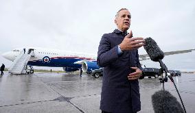 Mark Carney Speaks To Press Before Boarding Plane - Ottawa