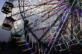 Illustration - Illuminated View Of Swings - Pushkar