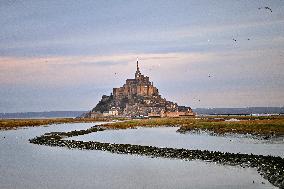Mont-Saint-Michel and its bay in northwestern France. FC