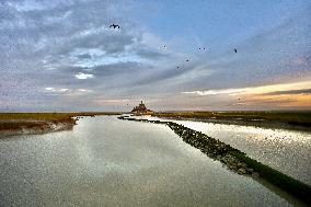 Mont-Saint-Michel and its bay in northwestern France. FC