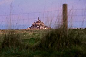 Mont-Saint-Michel and its bay in northwestern France. FC