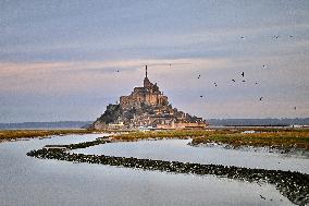 Mont-Saint-Michel and its bay in northwestern France. FC