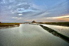 Mont-Saint-Michel and its bay in northwestern France. FC