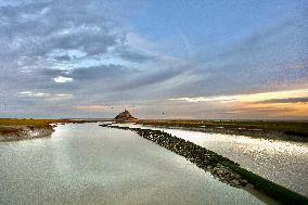 Mont-Saint-Michel and its bay in northwestern France. FC