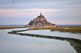 Mont-Saint-Michel and its bay in northwestern France. FC