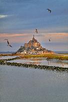 Mont-Saint-Michel and its bay in northwestern France. FC