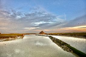 Mont-Saint-Michel and its bay in northwestern France. FC