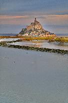 Mont-Saint-Michel and its bay in northwestern France. FC