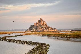 Mont-Saint-Michel and its bay in northwestern France. FC