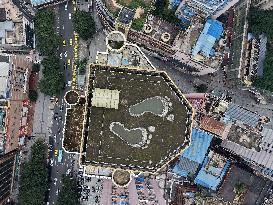 Giant Footprints on Building Rooftop in Chongqing
