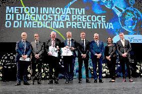 Mark Caulfield and Douglas F. Easton Receiving "Lombardy is Research" Award - Milan