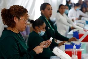 Vaccination Program Against Covid-19 and Influenza - Mexico City