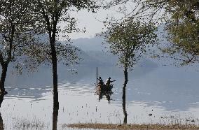 Fishermen in Phangota Lake - India