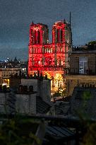 Notre Dame Lights Up In Red - Paris