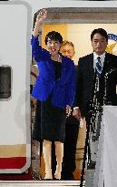 Japan PM Takaichi returns home