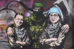 Provocative Wall Art Depicting Thunberg and Albanese with a Hamas Militant - Milan