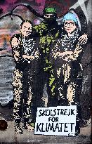 Provocative Wall Art Depicting Thunberg and Albanese with a Hamas Militant - Milan