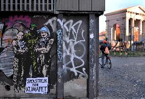 Provocative Wall Art Depicting Thunberg and Albanese with a Hamas Militant - Milan