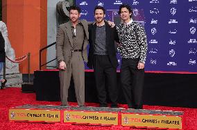 Jonas Brothers Hand And Footprint In Cement Ceremony - LA