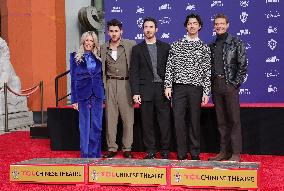 Jonas Brothers Hand And Footprint In Cement Ceremony - LA