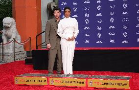 Jonas Brothers Hand And Footprint In Cement Ceremony - LA