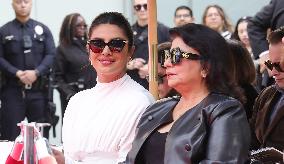 Jonas Brothers Hand And Footprint In Cement Ceremony - LA