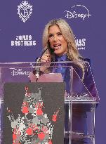 Jonas Brothers Hand And Footprint In Cement Ceremony - LA