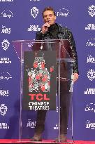 Jonas Brothers Hand And Footprint In Cement Ceremony - LA