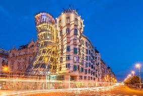 Dancing House or Ginger and Fred at night by Frank Gehry, busy traffic light trails, Prague, Bohemia, Czech Republic, EU, Europe