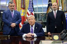 US President Donald J. Trump delivers remarks during a signing ceremony in the Oval Office