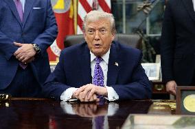US President Donald J. Trump delivers remarks during a signing ceremony in the Oval Office
