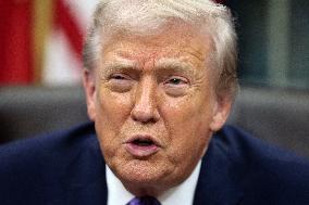 US President Donald J. Trump delivers remarks during a signing ceremony in the Oval Office