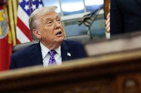 US President Donald J. Trump delivers remarks during a signing ceremony in the Oval Office