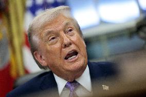 US President Donald J. Trump delivers remarks during a signing ceremony in the Oval Office