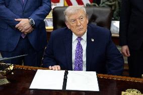 US President Donald J. Trump delivers remarks during a signing ceremony in the Oval Office