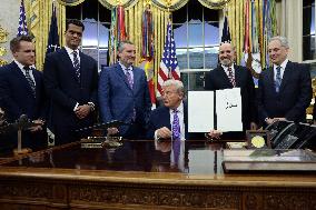US President Donald J. Trump delivers remarks during a signing ceremony in the Oval Office