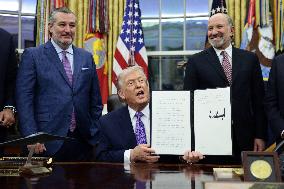 US President Donald J. Trump delivers remarks during a signing ceremony in the Oval Office
