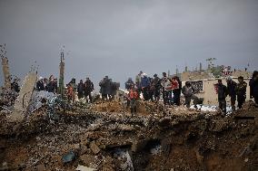Search and Rescue Efforts Continue After Building Collapse - Gaza