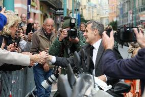 Nicolas Sarkozy And Son Leave Restaurant To Attend Book Signing - France