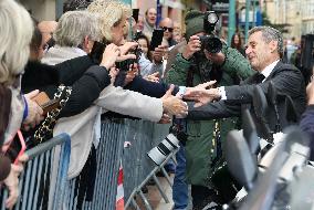 Nicolas Sarkozy And Son Leave Restaurant To Attend Book Signing - France