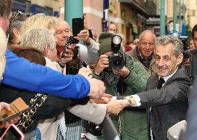 Nicolas Sarkozy And Son Leave Restaurant To Attend Book Signing - France