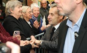 Nicolas Sarkozy And Son Leave Restaurant To Attend Book Signing - France