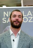 Nicolas and Louis Sarkozy At Public Book Signing - France