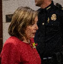 Former House Speaker Nancy Pelosi walks out  after  the  classified briefing