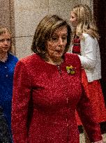 Former House Speaker Nancy Pelosi walks out  after  the  classified briefing